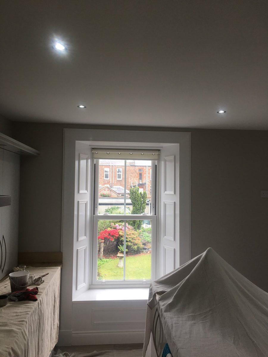 Freshly decorated bedroom with sash window